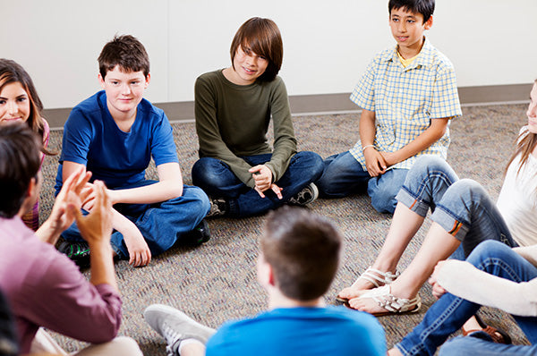 Teacher talking with students